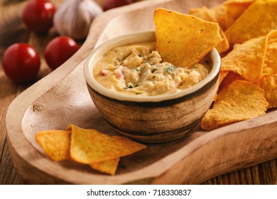 Mexican Cheese Dip Served With Nachos.
