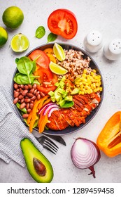 Mexican Chicken Burrito Bowl With Rice, Beans, Tomato, Avocado,corn And Spinach, White Background. Mexican Cuisine Food Concept.