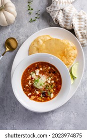 Mexican Chicken Soup Topped With Cotija Cheese Served With Fried Tortillas