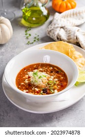 Mexican Chicken Soup Topped With Cotija Cheese Served With Fried Tortillas