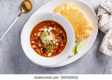 Mexican Chicken Soup Topped With Cotija Cheese Served With Fried Tortillas