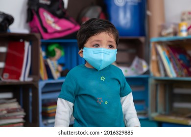 Mexican child wearing face mask and crying on back to school after coronavirus pandemic