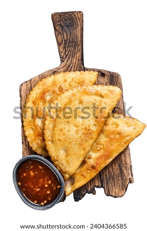 Mexican chilean food fried empanadas pie with beef meat. Isolated on white background, top view.