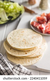 Mexican Corn Tortillas on the cutting board. - Shutterstock ID 2240411059