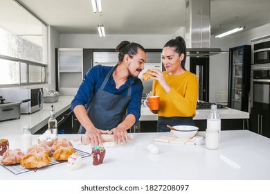 Mexican Couple Baking And Eating Bread Called Pan De Muerto Traditional From Mexico In Halloween