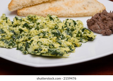 Mexican Cuisine. Scrambled Eggs With Spinach And Beans