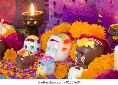 Mexican Day of the dead altar created entirely for this image session. Carefully arranged all the pieces, candles and flowers.
