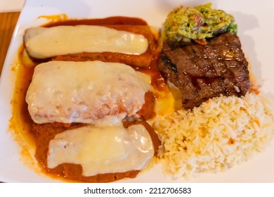 Mexican Enchiladas With Rice, Beef Steak And Guacamole. Traditional Combo Menu