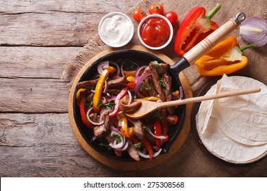 Mexican Fajitas On A Table In A Rustic Style. Horizontal View From Above
