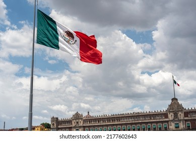 Mexican flag waving with blue sky and clouds and the national palace in the background in Mexico City  - Flag Waving, Mexico Flag