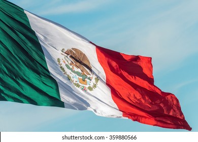 Mexican Flag Weaving On Sky Background