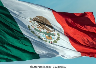 Mexican Flag Weaving On Sky Background