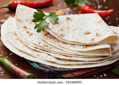 Mexican flatbread tortilla on wooden table