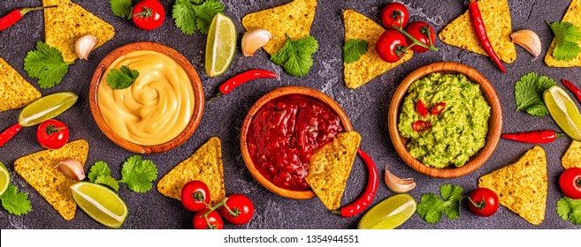 Mexican Food Background: Guacamole, Salsa, Cheesy Sauces With Ingredients On Black Background, Top View.