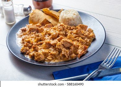 Mexican Food: Chipotle Cream Chicken Served With Rice And Nachos.