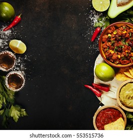 Mexican Food Concept: Tortilla Chips, Guacamole, Salsa, Chilli With Beans, Tequila Shots And Fresh Ingredients Over Vintage Rusty Metal Background. Top View