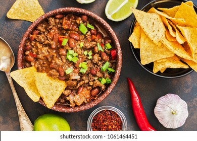 Mexican food dish chili con carne. The concept of Mexican cuisine. Top view, old, rusty background - Shutterstock ID 1061464451