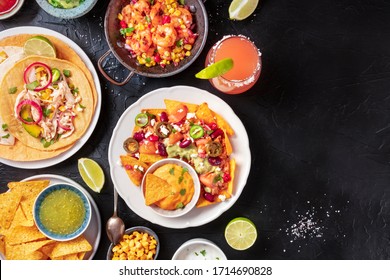 Mexican Food, A Flat Lay On A Dark Background With Copy Space. Nachos, Tortillas, Paloma Cocktails, Shot From Above