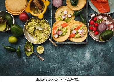 Mexican Food. Fresh Guacamole Salsa With Grill Salmon, Corn Tortilla And Veggies. Copy Space.