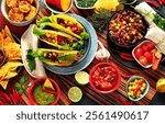 Mexican food, many dishes of the mexican cuisine on dark background