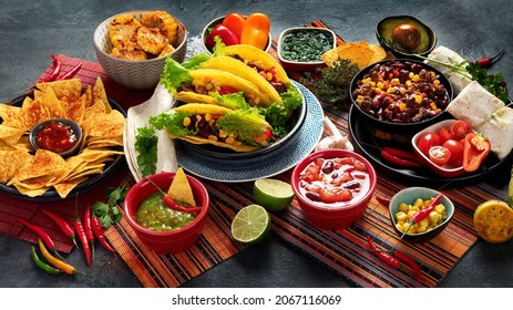 Mexican food, many dishes of the mexican cuisine on dark background