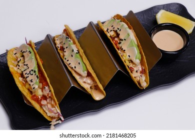 Mexican Food Stuffed Taco With Seafood And Chicken In A Serving Stand