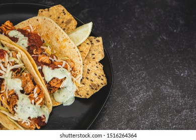 Mexican Fresh Chicken Tacos With Cabbage, Cheese And Cilantro Cream Sauce In A Flour Tortilla With Multigrain Corn Tortilla Chips