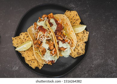 Mexican Fresh Chicken Tacos With Cabbage, Cheese And Cilantro Cream Sauce In A Flour Tortilla With Multigrain Corn Tortilla Chips