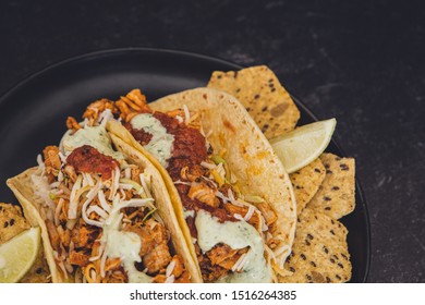 Mexican Fresh Chicken Tacos With Cabbage, Cheese And Cilantro Cream Sauce In A Flour Tortilla With Multigrain Corn Tortilla Chips