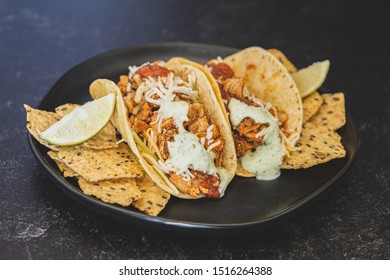 Mexican Fresh Chicken Tacos With Cabbage, Cheese And Cilantro Cream Sauce In A Flour Tortilla With Multigrain Corn Tortilla Chips