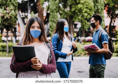 Mexican Girl Student Wearing Mask Face To Prevent Infection Or Respiratory Illness, Latin People With Protection Against Contagious Coronavirus In Mexico Or Latin America