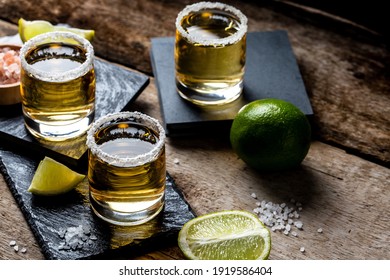 Mexican Gold Tequila with lime and salt on stone background. concept luxury drink. Alcoholic drink