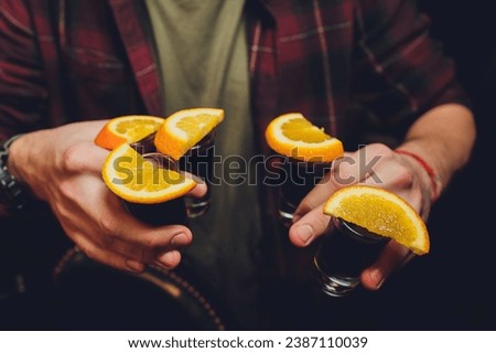 Mexican Gold Tequila with lime and salt on black background with copyspace