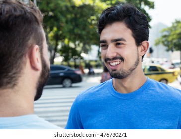 Mexican Guy Talking With Caucasian Friend