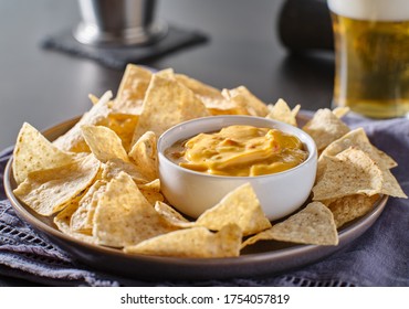 Mexican Hot Queso Cheese Dip With Corn Tortilla Chips On Plate