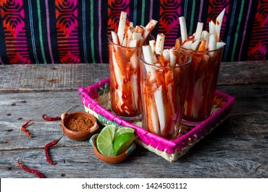 Mexican jicama fruit cutted with green  lime, chili powder and chamoy