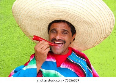 Mexican Man Poncho Sombrero Eating Red Chili Hot Pepper Mexico