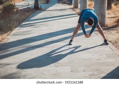 Mexican man stretching for exercising outdoors - Powered by Shutterstock