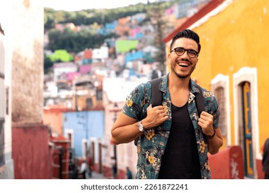 Mexican man visiting colorful Guanajuato historic center.