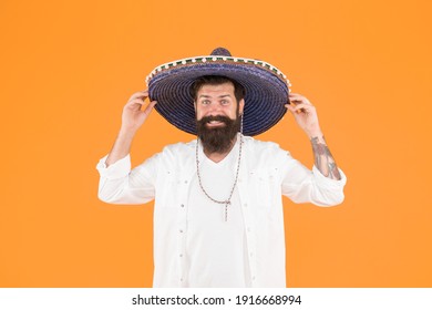 Mexican man wearing sombrero. Guy in wide brim hat. Ethnic concept. Ethnic background. Ancestry language and cultural traditions. Discover ethnic and geographic origins. Bearded man in mexican hat. - Shutterstock ID 1916668994