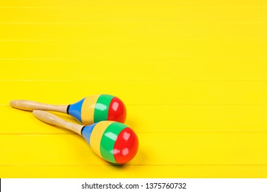 Mexican Maracas On Yellow Wooden Table