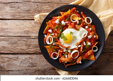 Mexican Nachos With Tomato Salsa, Chicken And Egg Close-up On A Plate. Horizontal View From Above
