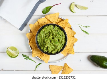 Mexican nachos tortilla chips with guacamole. Top view - Shutterstock ID 1313232731
