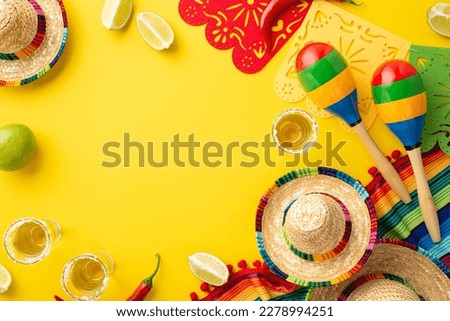 Mexican national holiday concept. Top view photo of tequila with salt lime sombrero colorful striped poncho garland and maracas on isolated vibrant yellow background with empty space