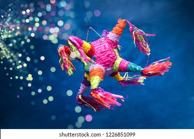 Mexican Piñata Party Hanging On Blue And Green Background With Multi-colored Glitters Celebrating Birthday, Christmas, Party, Party Songs, Figure In The Shape Of Star And Donkey, Family Fun