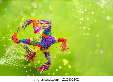 Mexican Piñata Party Hanging On Blue And Green Background Celebrating Birthday, Christmas, Party, Party Songs, Figure In The Shape Of Star And Donkey, Family Fun, Mexican Pinata Used On Posadas