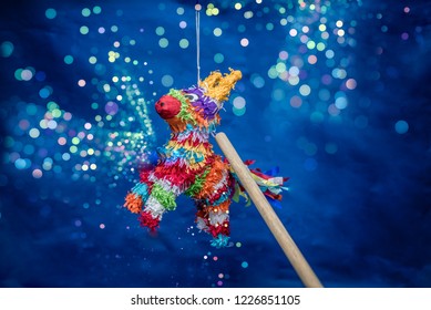 Mexican Piñata Party Hanging On Blue And Green Background With Multi-colored Glitters Celebrating Birthday, Christmas, Party, Party Songs, Figure In The Shape Of Star And Donkey, Family Fun