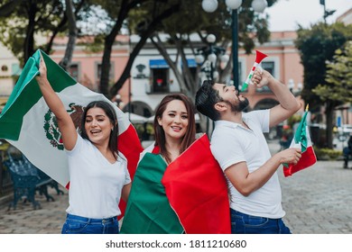 Mexican People And Soccer Fans From Mexico With Mexican Flag