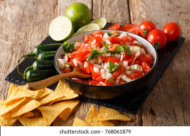 Mexican Pico De Gallo With Ingredients Closeup And Nachos On The Table. Horizontal
