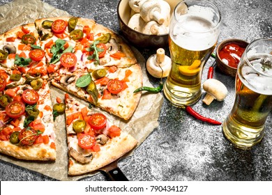 Mexican pizza with cold beer. On a rustic background. - Powered by Shutterstock